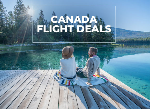 Couple seating by a lake